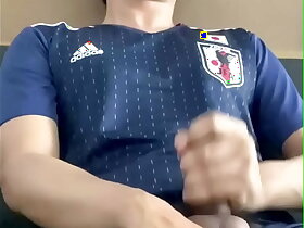 Cum shot Asian guy playing with his big cock in japanese football suit